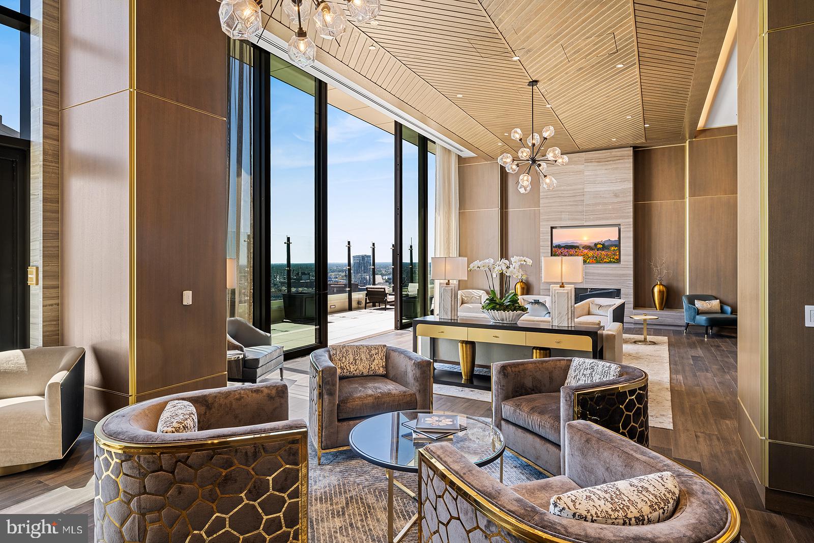 1911 Walnut Street, Unit PH4701 Philadelphia, PA 19103 - Photo 14 of 29 a living room with furniture and a large window