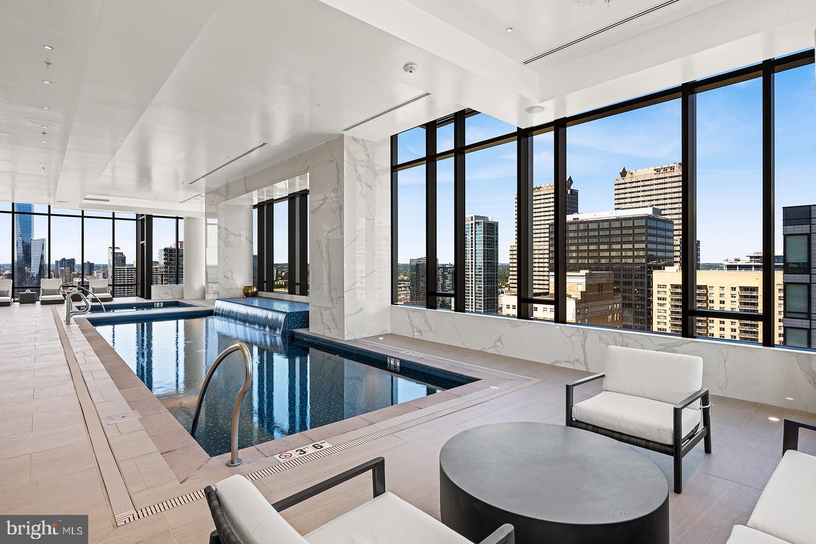 1911 Walnut Street, Unit PH4701 Philadelphia, PA 19103 - Photo 20 of 29 a living room with furniture and a large window