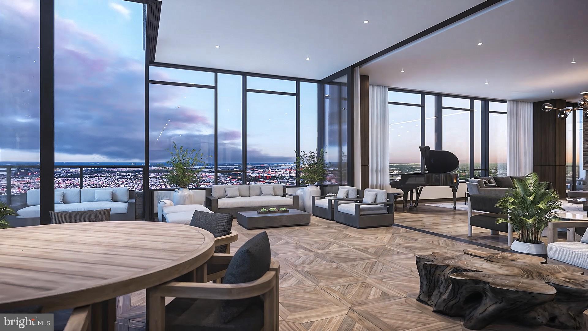 1911 Walnut Street, Unit PH4701 Philadelphia, PA 19103 - Photo 2 of 29 a living room with furniture large windows and wooden floor