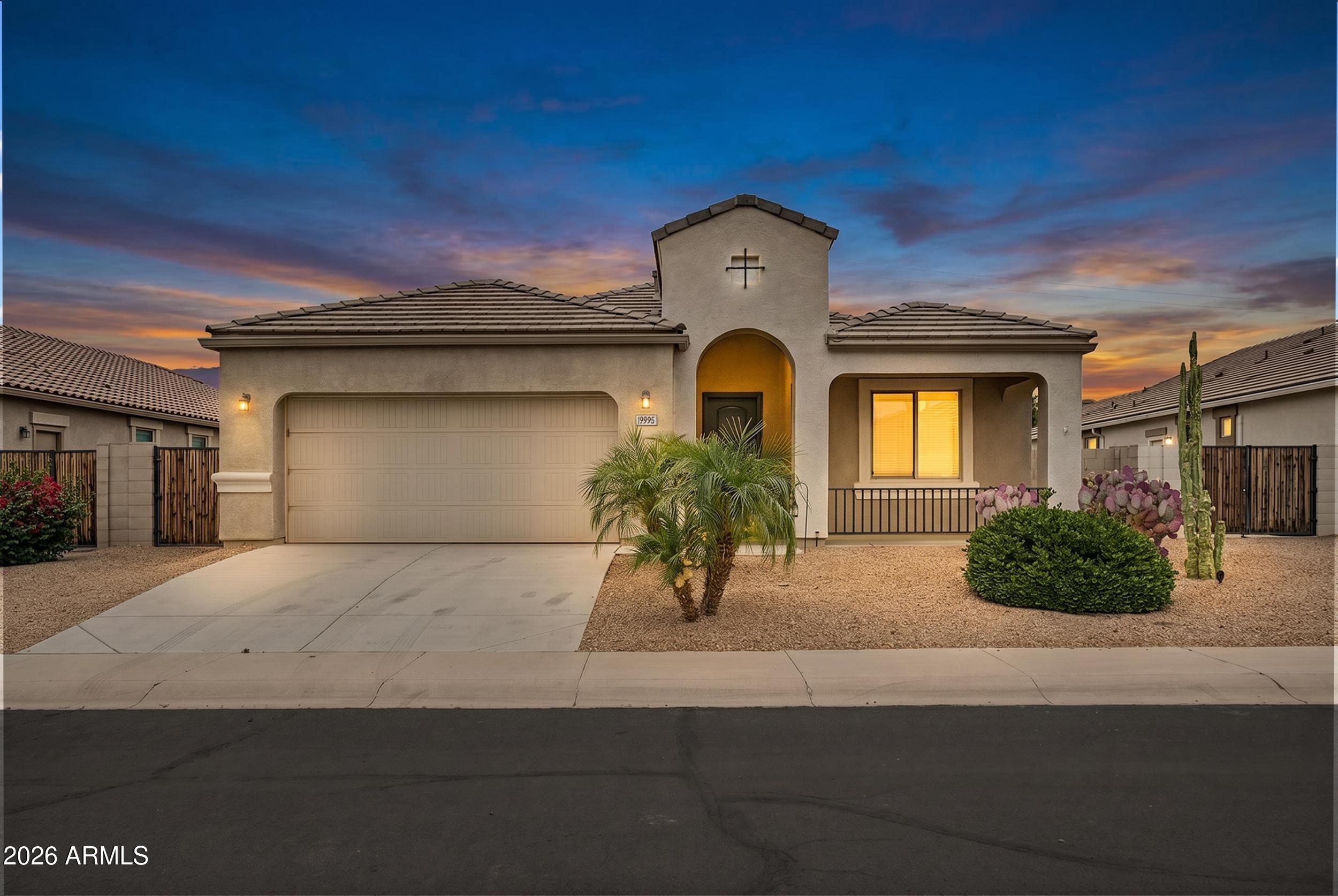 19995 North Ben Court Maricopa, AZ 85138 - Photo 1 of 51 a front view of a house with garden