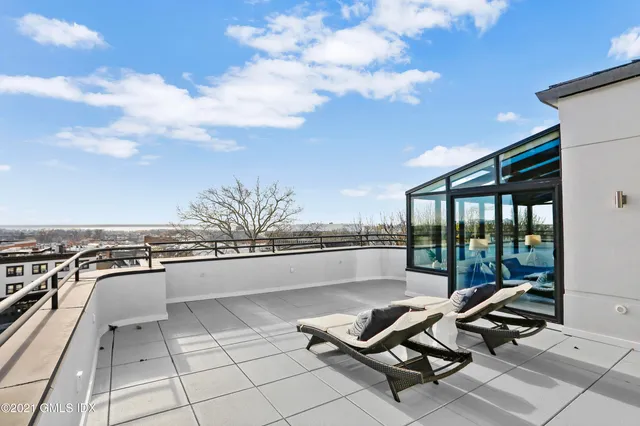 a view of a terrace with chairs