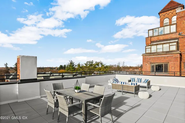 a view of a balcony with furniture