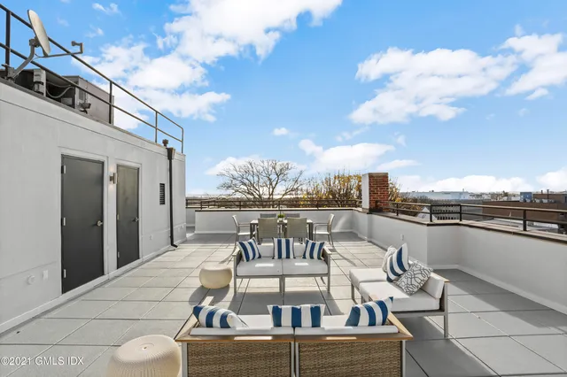 a view of a terrace with sitting area