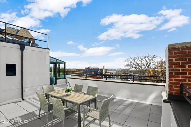 a view of a terrace with sitting area