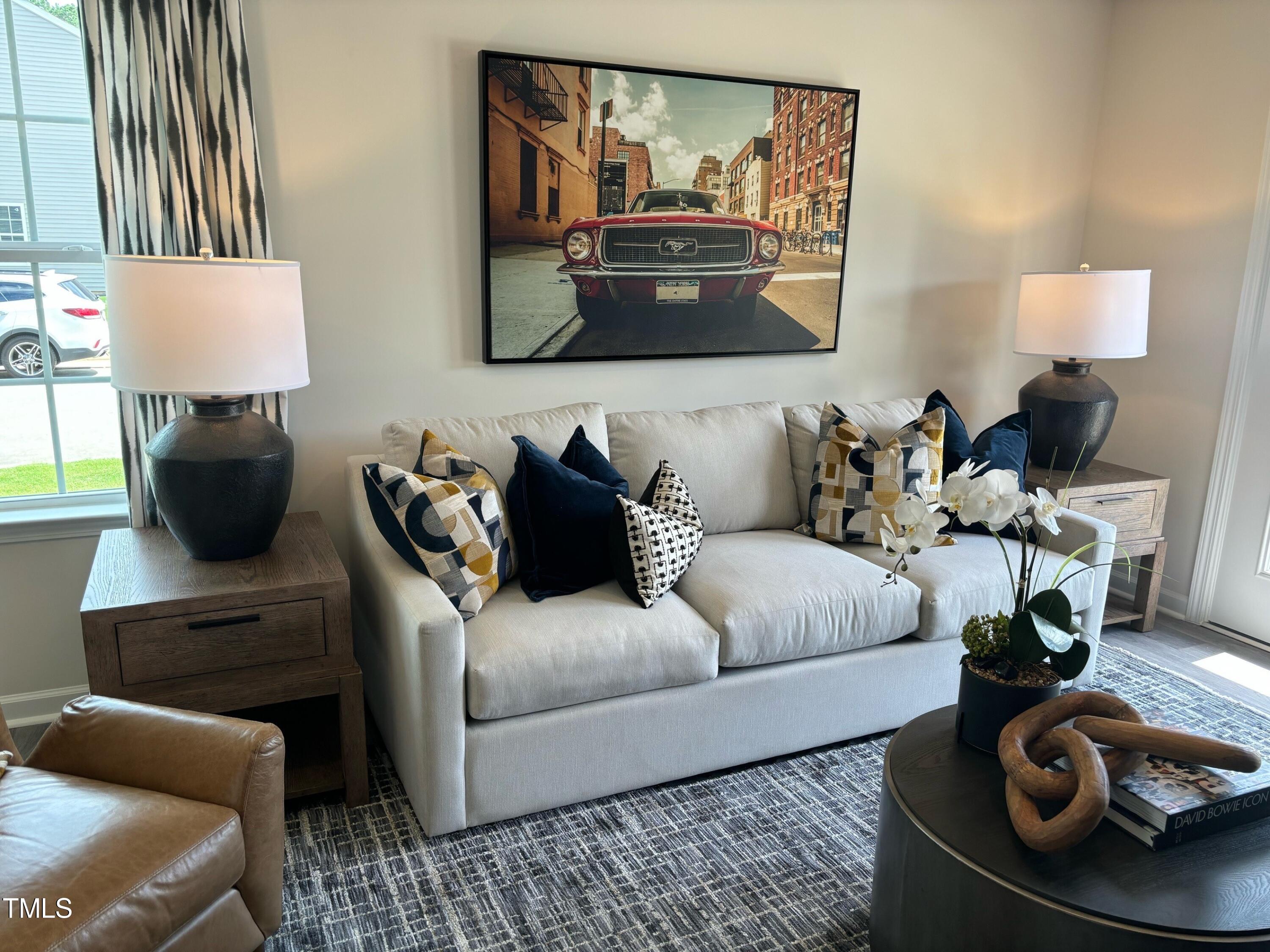 8750 Asher Gray Way Raleigh, NC 27616 - Photo 4 of 22 a living room with furniture and a lamp