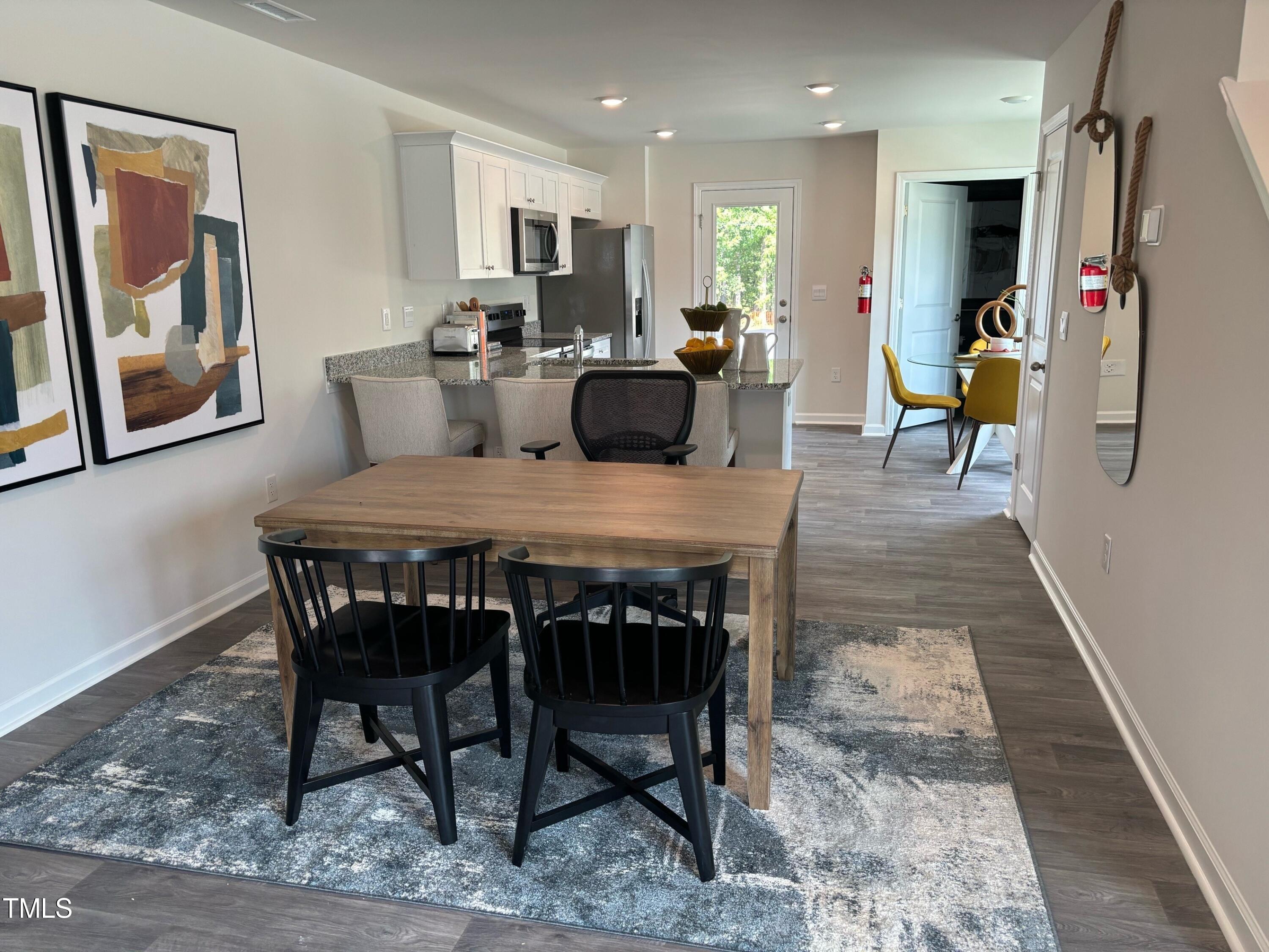 8750 Asher Gray Way Raleigh, NC 27616 - Photo 5 of 22 a view of a dining room with furniture