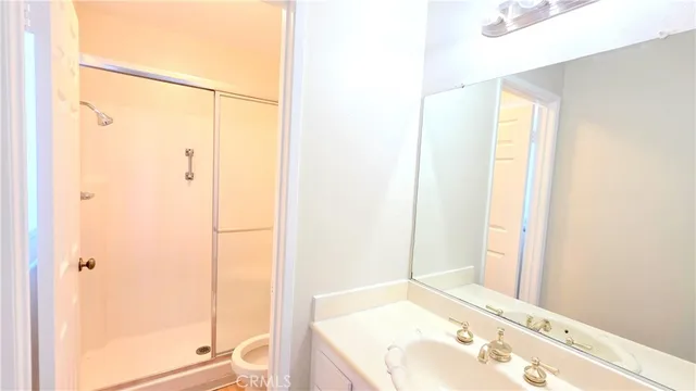 a bathroom with a tub and shower