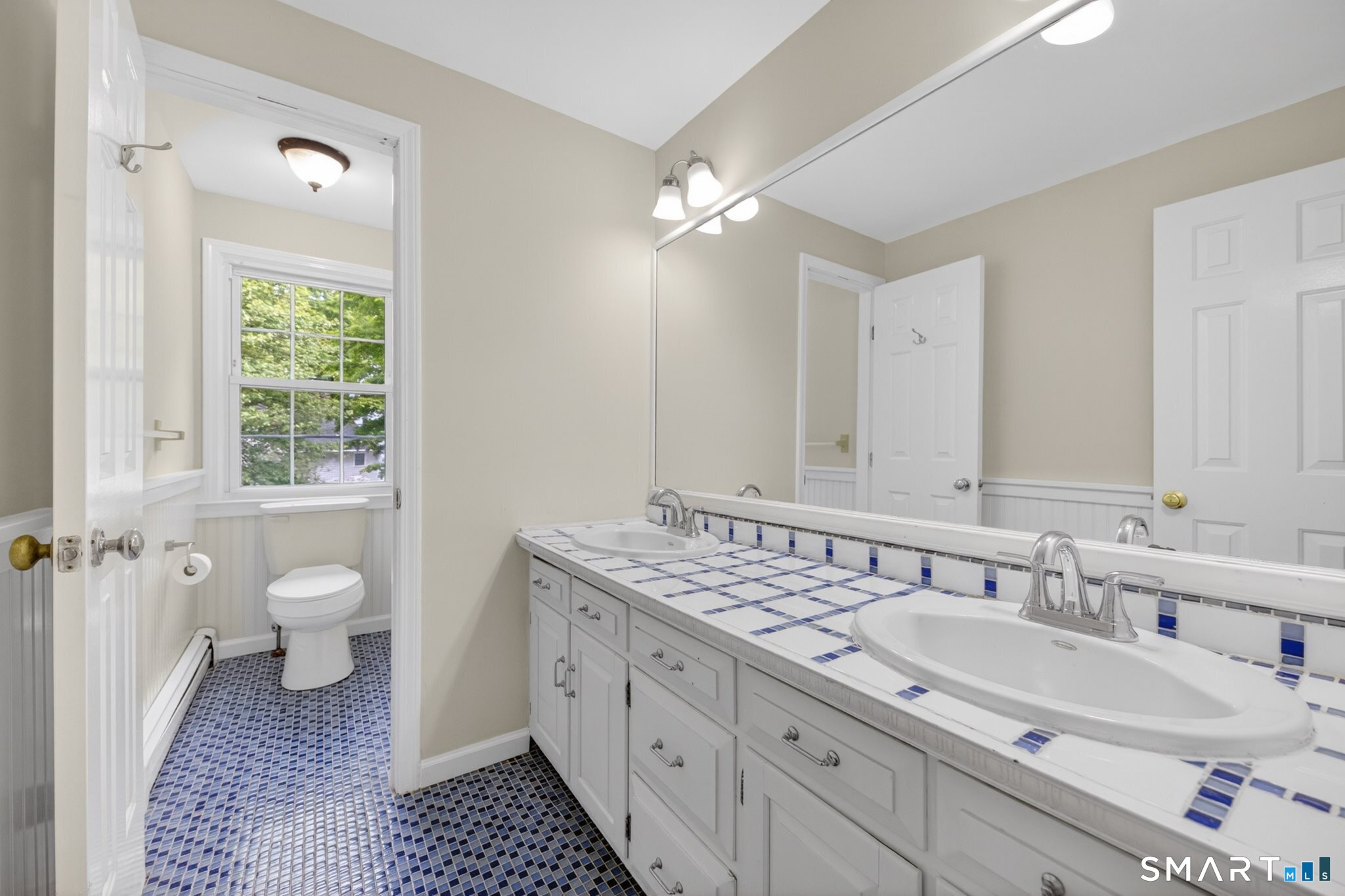 70 Barrack Hill Road Ridgefield, CT 06877 - Photo 18 of 32 a spacious bathroom with a granite countertop double vanity sink a mirror and a toilet