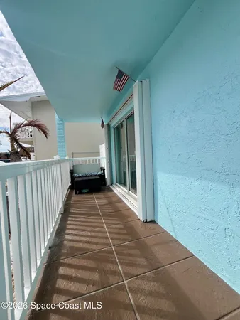 a view of a porch with wooden floor