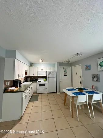 a kitchen with stainless steel appliances kitchen island granite countertop a sink and cabinets