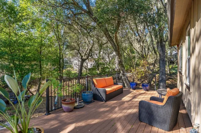 a view of a patio with table and chairs and potted plants