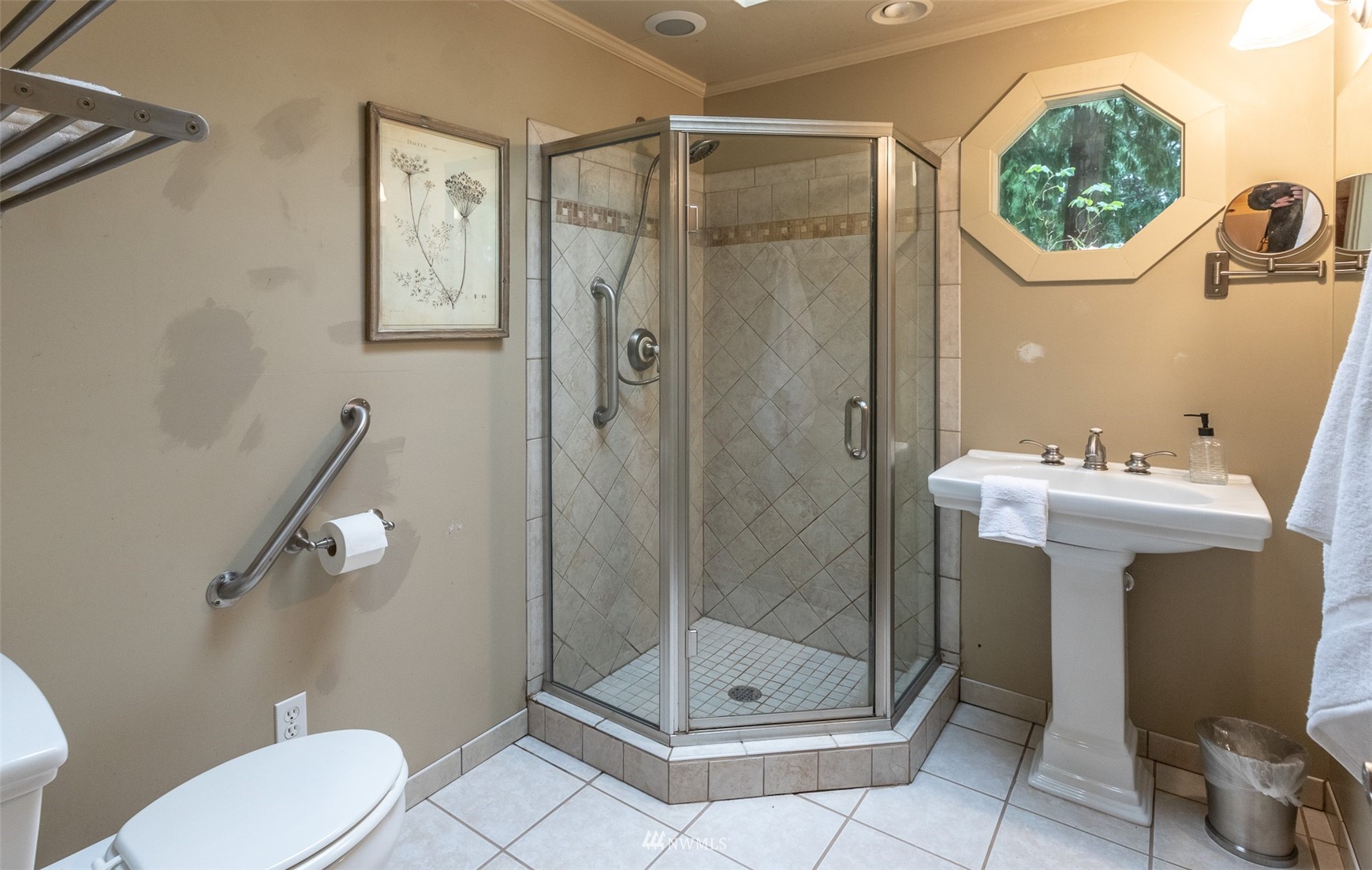 8691 Weidkamp Road Lynden, WA 98264 - Photo 13 of 39 a bathroom with a shower a mirror a toilet and a sink