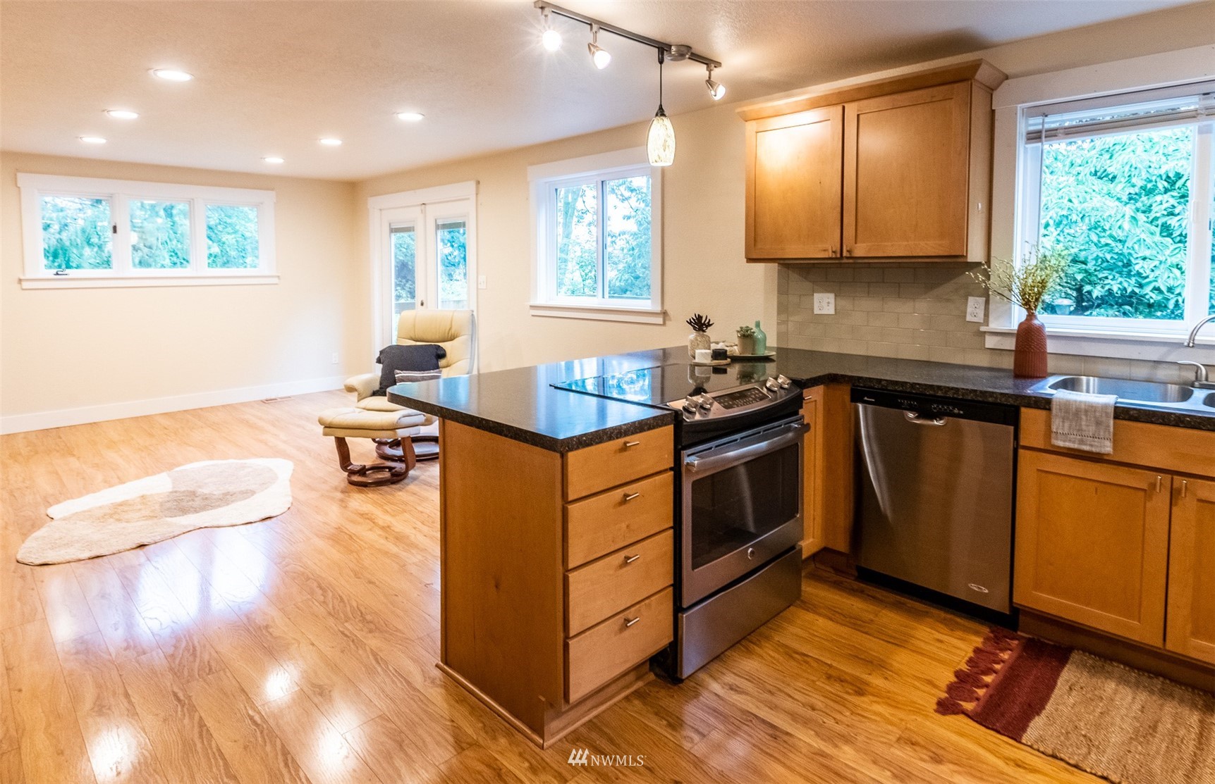 8691 Weidkamp Road Lynden, WA 98264 - Photo 21 of 39 a kitchen with a sink stove and cabinets