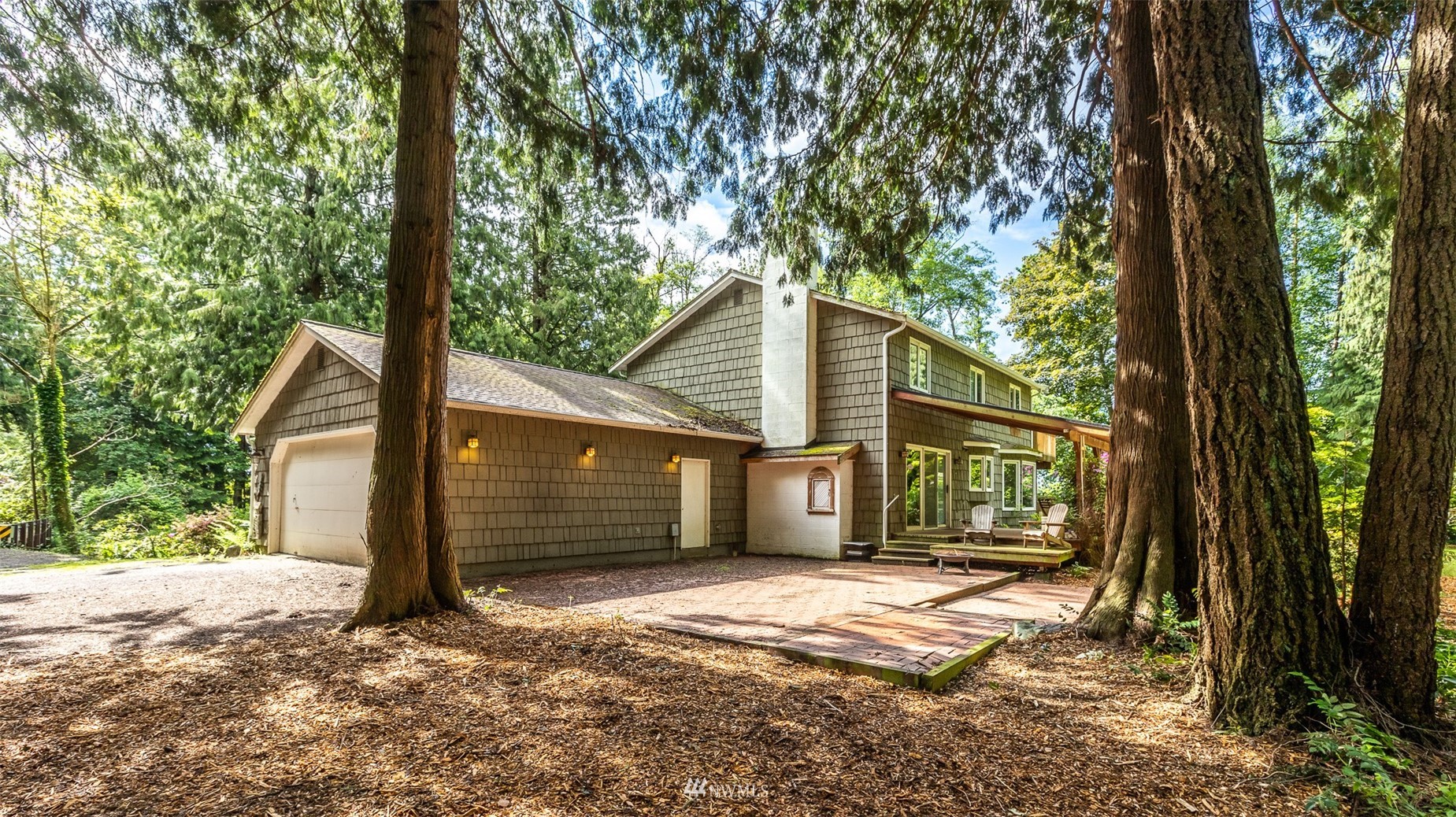 8691 Weidkamp Road Lynden, WA 98264 - Photo 25 of 39 a front view of a house with a yard and garage