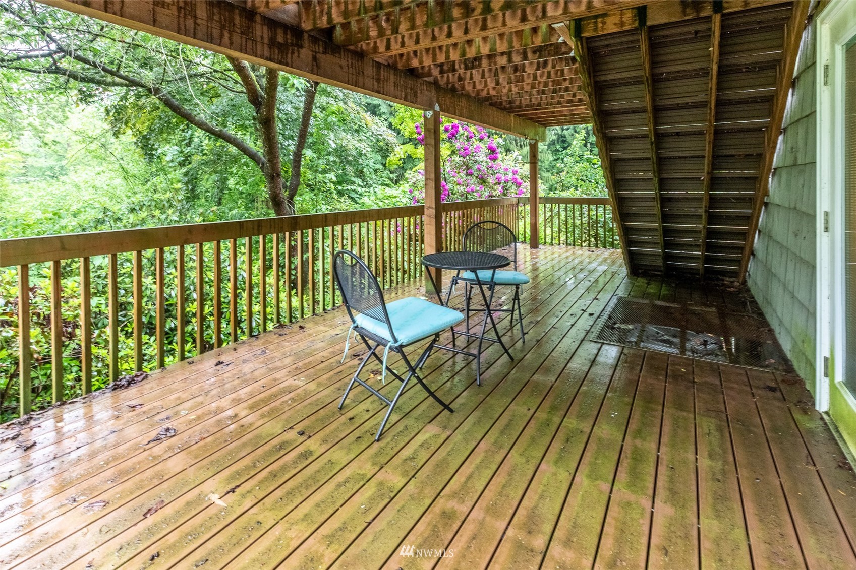 8691 Weidkamp Road Lynden, WA 98264 - Photo 27 of 39 a view of balcony with chairs and wooden floor