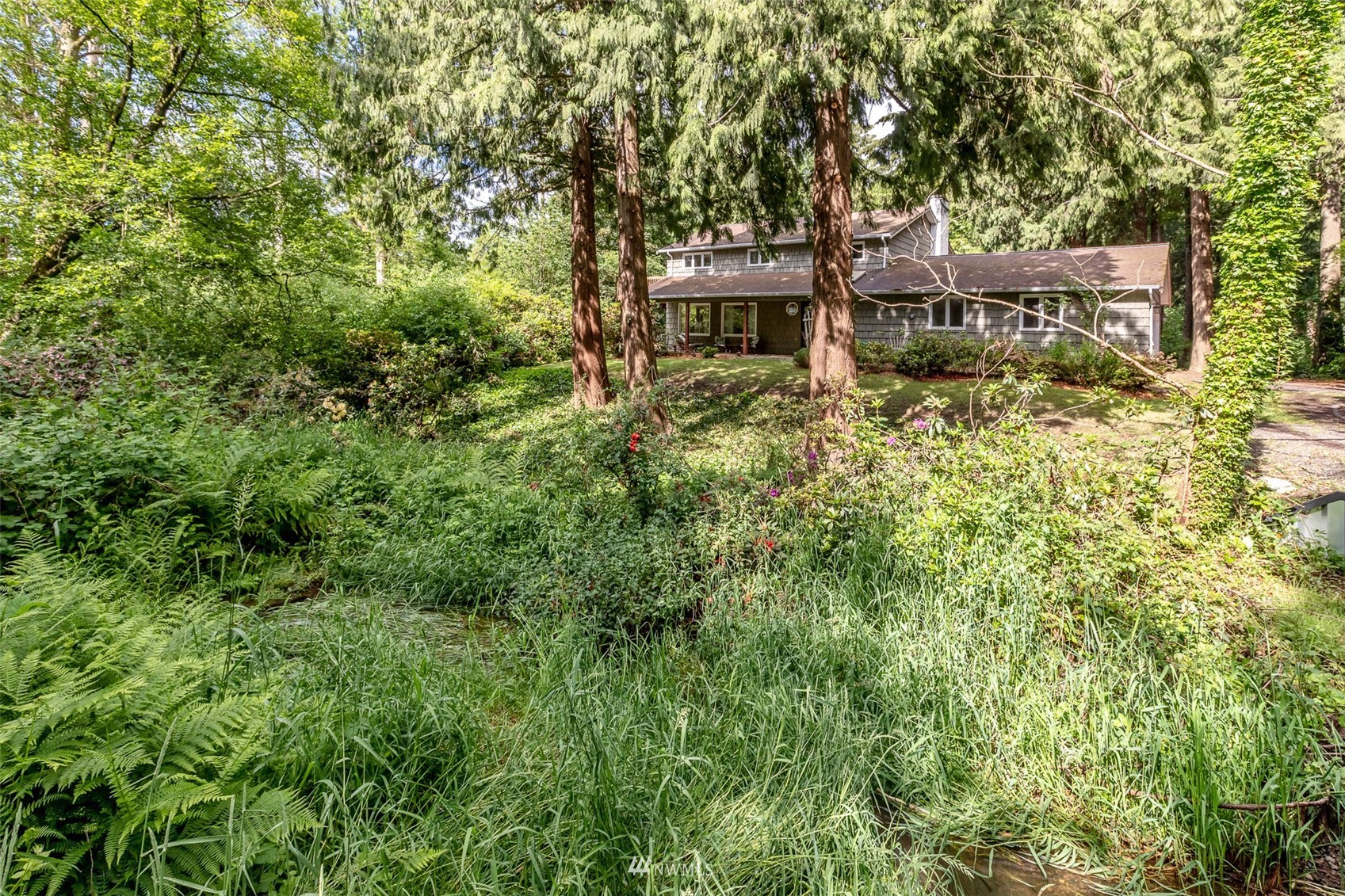 8691 Weidkamp Road Lynden, WA 98264 - Photo 32 of 39 an aerial view of a house with swimming pool and sitting area