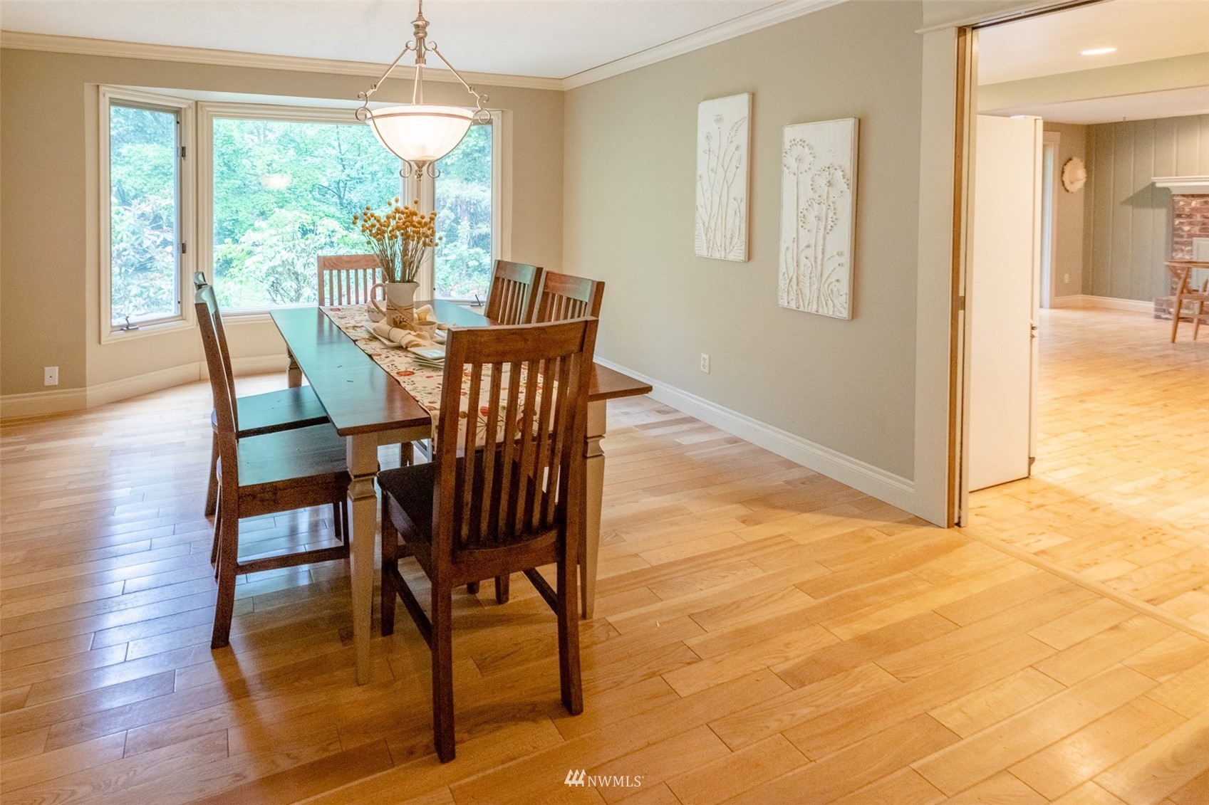 8691 Weidkamp Road Lynden, WA 98264 - Photo 9 of 39 a view of a dining room with furniture wooden floor and a chandelier