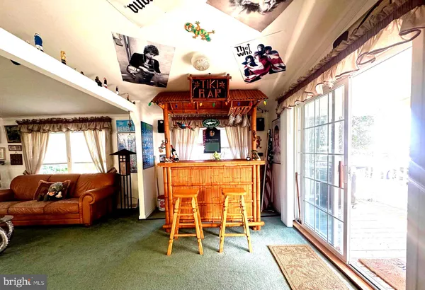 a kitchen with stainless steel appliances a refrigerator sink and white cabinets
