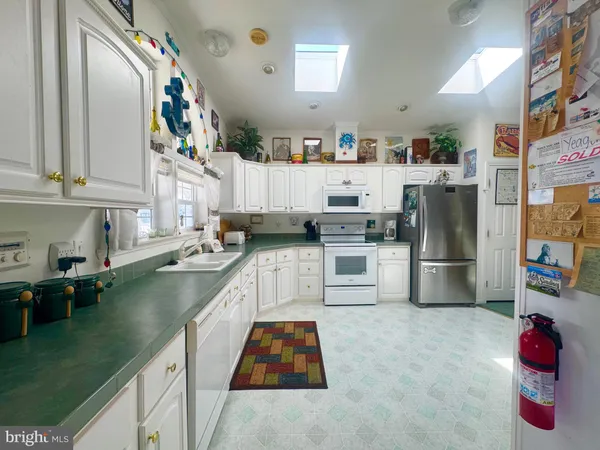 a living room with furniture toys and a large window