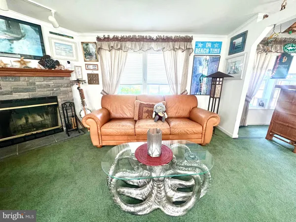 a living room with furniture rug and window