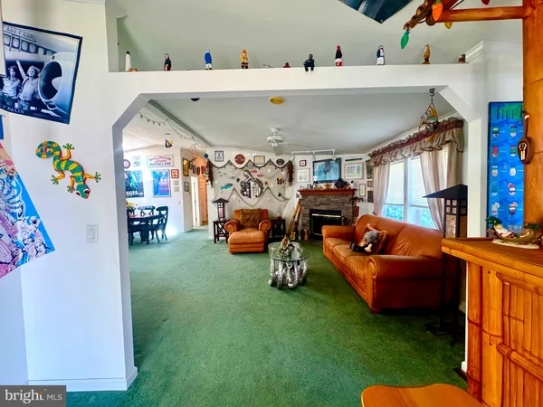 a bathroom with a granite countertop shower sink and mirror