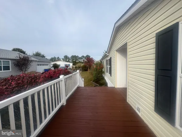 a view of a porch with wooden floor and outdoor space