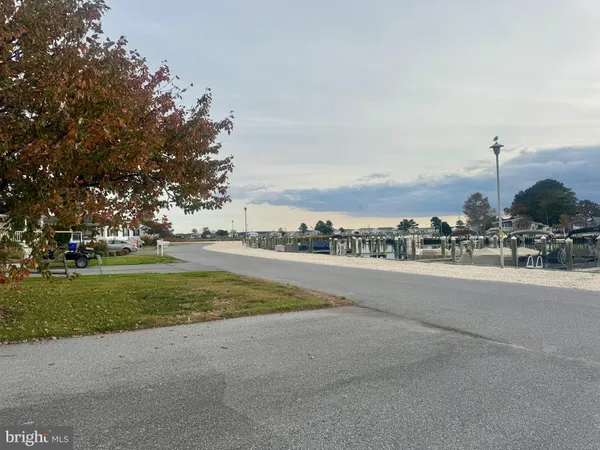 a dining room with furniture and a chandelier