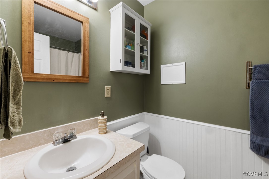 8264 Siege Road Mechanicsville, VA 23111 - Photo 17 of 29 a bathroom with a sink and a toilet