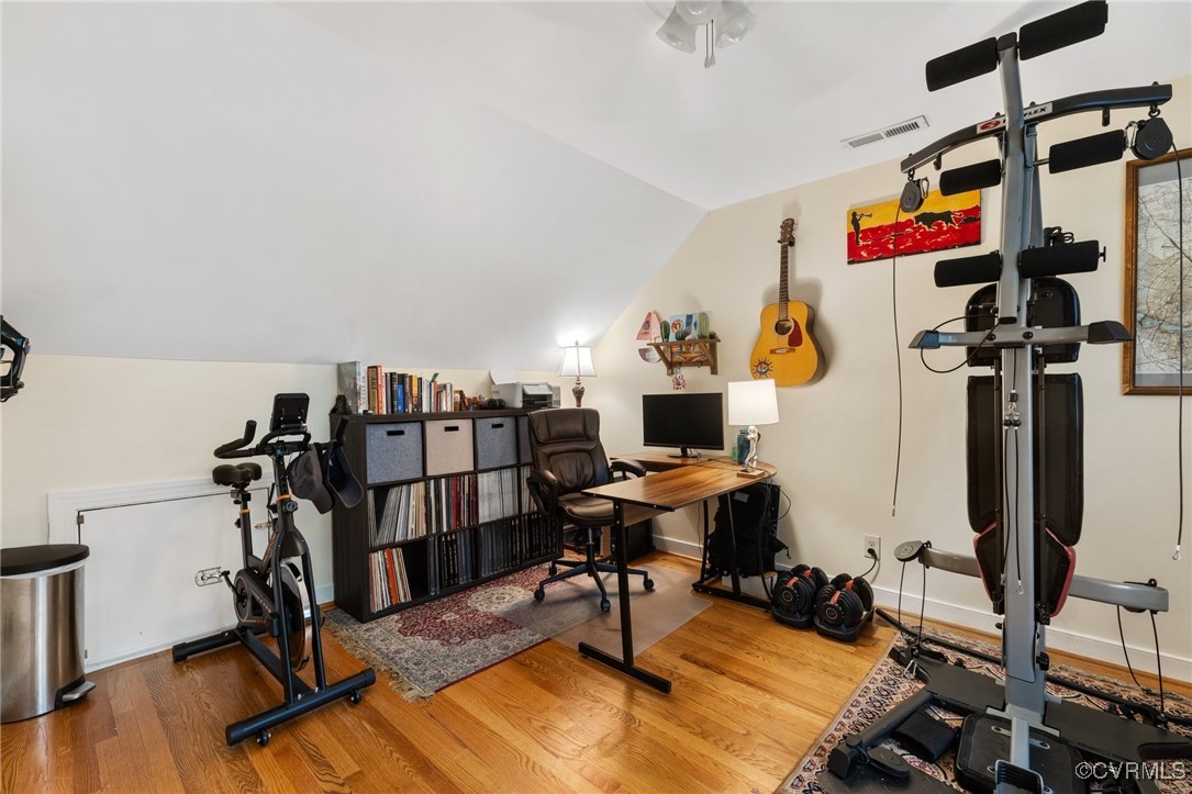 8264 Siege Road Mechanicsville, VA 23111 - Photo 18 of 29 a view of a workspace with furniture and a gym cycle