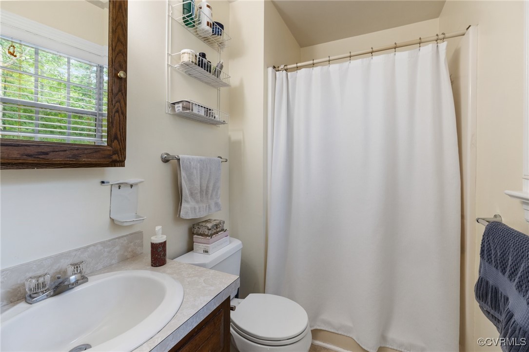 8264 Siege Road Mechanicsville, VA 23111 - Photo 23 of 29 a bathroom with a sink toilet and shower