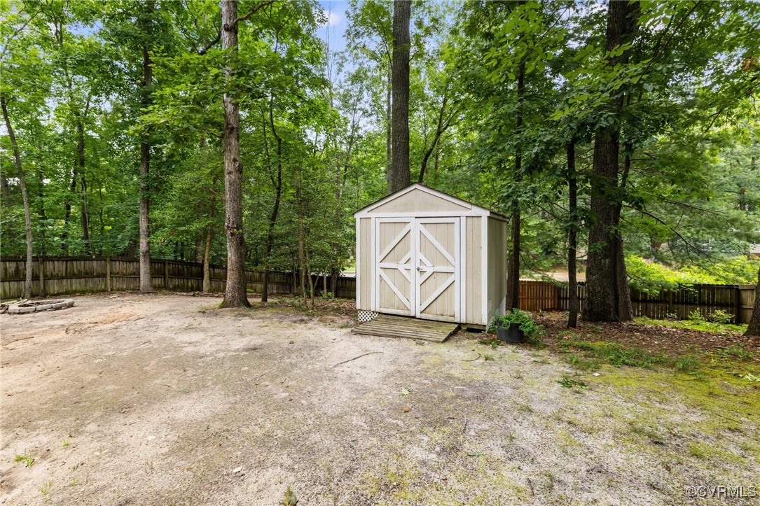 8264 Siege Road Mechanicsville, VA 23111 - Photo 29 of 29 a house with trees in the background