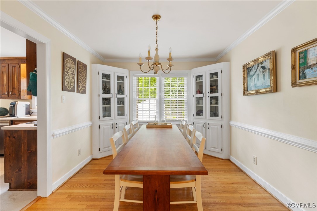 8264 Siege Road Mechanicsville, VA 23111 - Photo 7 of 29 a view of a dining room with furniture window and wooden floor