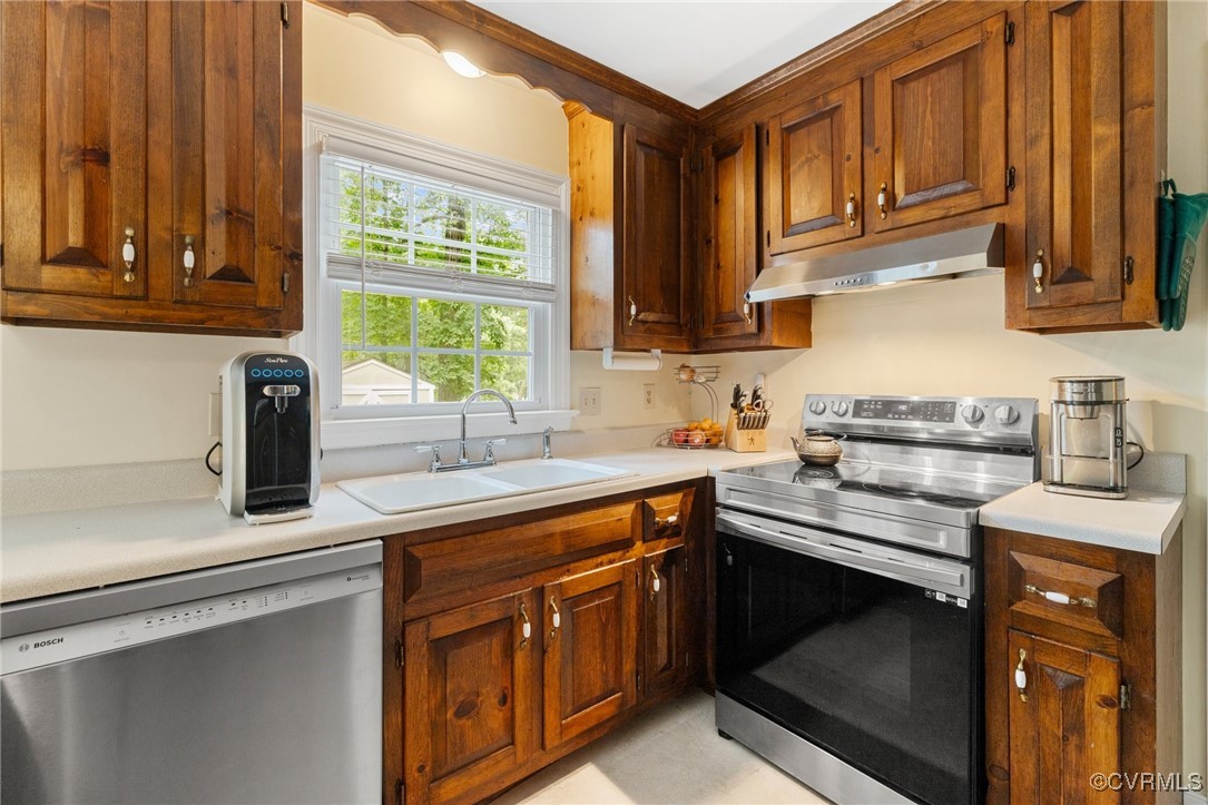 8264 Siege Road Mechanicsville, VA 23111 - Photo 10 of 29 a kitchen with stainless steel appliances granite countertop a sink stove and cabinets