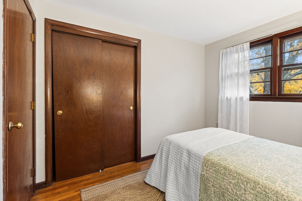 46 Linwood Street Andover, MA 01810 - Photo 17 of 28 a bedroom with a bed and a window