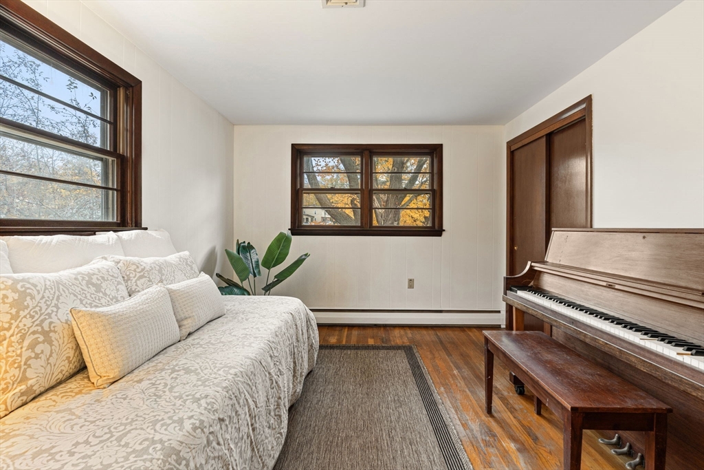 46 Linwood Street Andover, MA 01810 - Photo 19 of 28 a living room with a bed furniture and a window