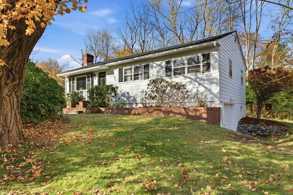 46 Linwood Street Andover, MA 01810 - Photo 2 of 28 a front view of a house with garden