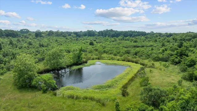 a view of a lake with a yard