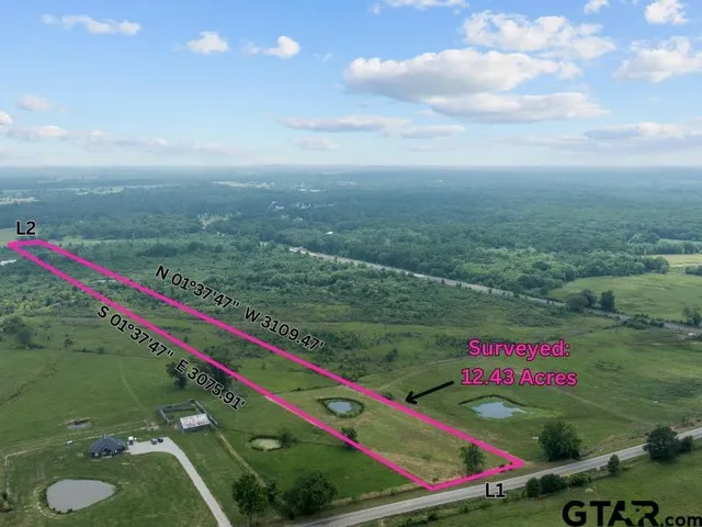 a view of a bench in front of a yard