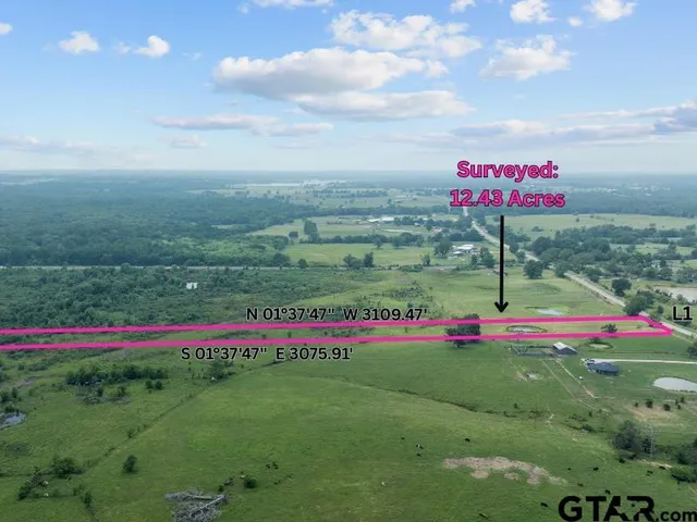 an aerial view of a houses with outdoor space