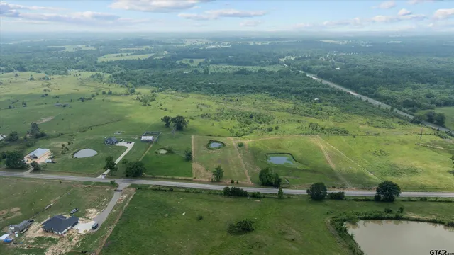 a view of a big yard with an outdoor seating and entertaining space
