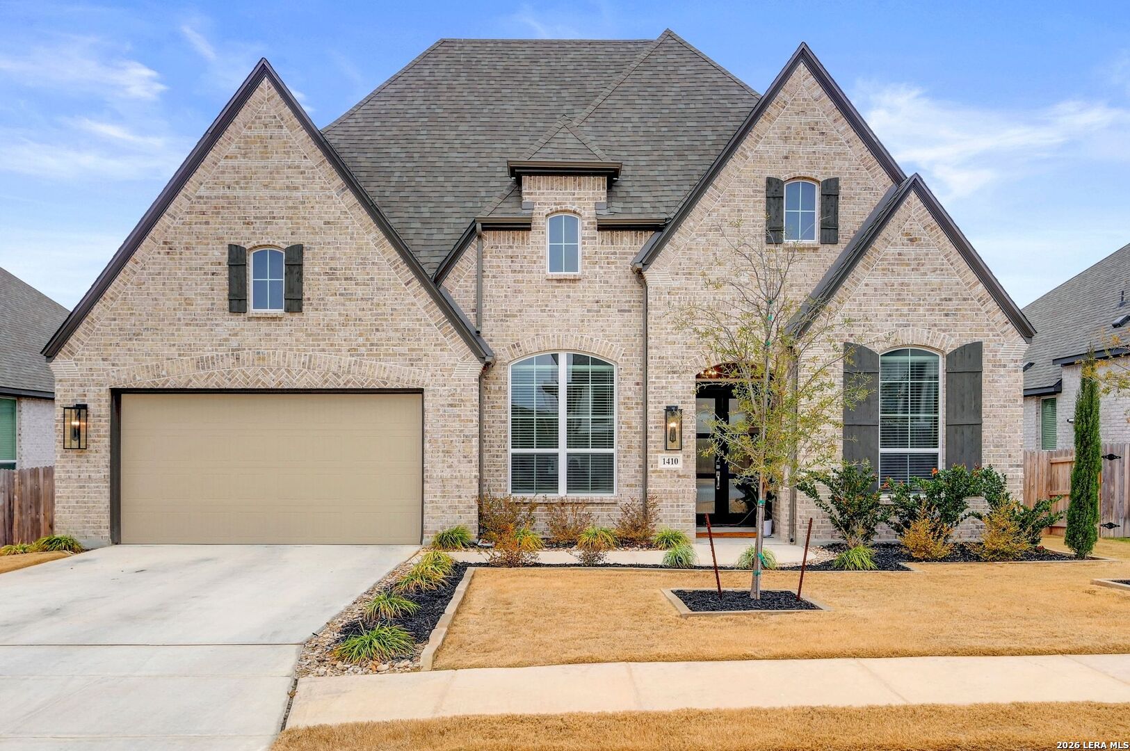 a front view of a house with a yard