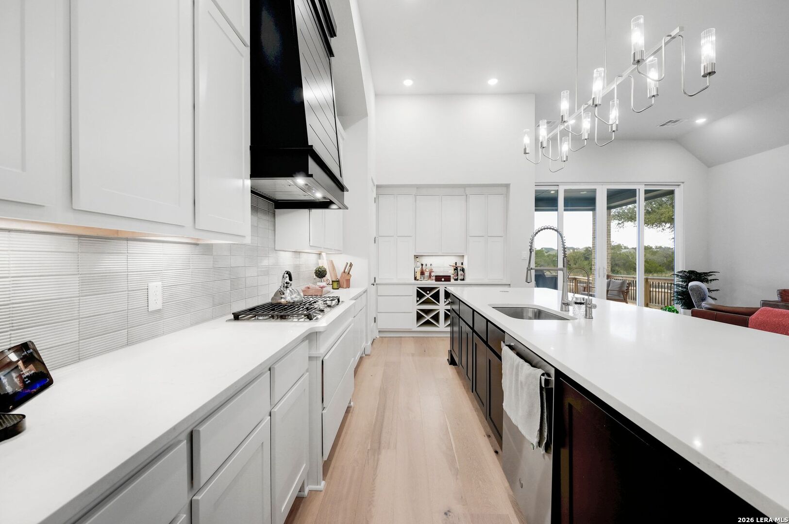 1410 Lytham Bulverde, TX 78163 - Photo 11 of 35 a kitchen with stainless steel appliances a sink stove and cabinets