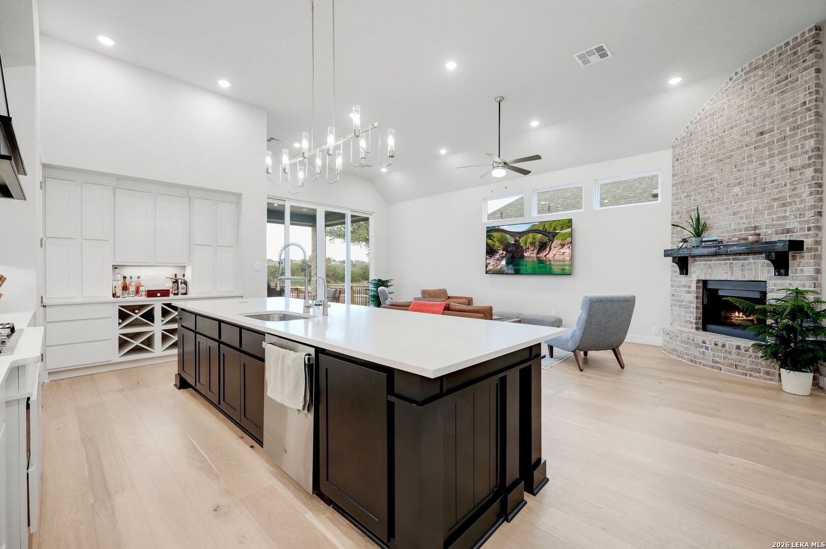 1410 Lytham Bulverde, TX 78163 - Photo 12 of 35 a kitchen with a stove a refrigerator and a wooden cabinets
