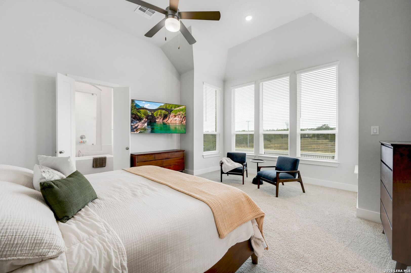 1410 Lytham Bulverde, TX 78163 - Photo 18 of 35 a bedroom with a bed and a large window