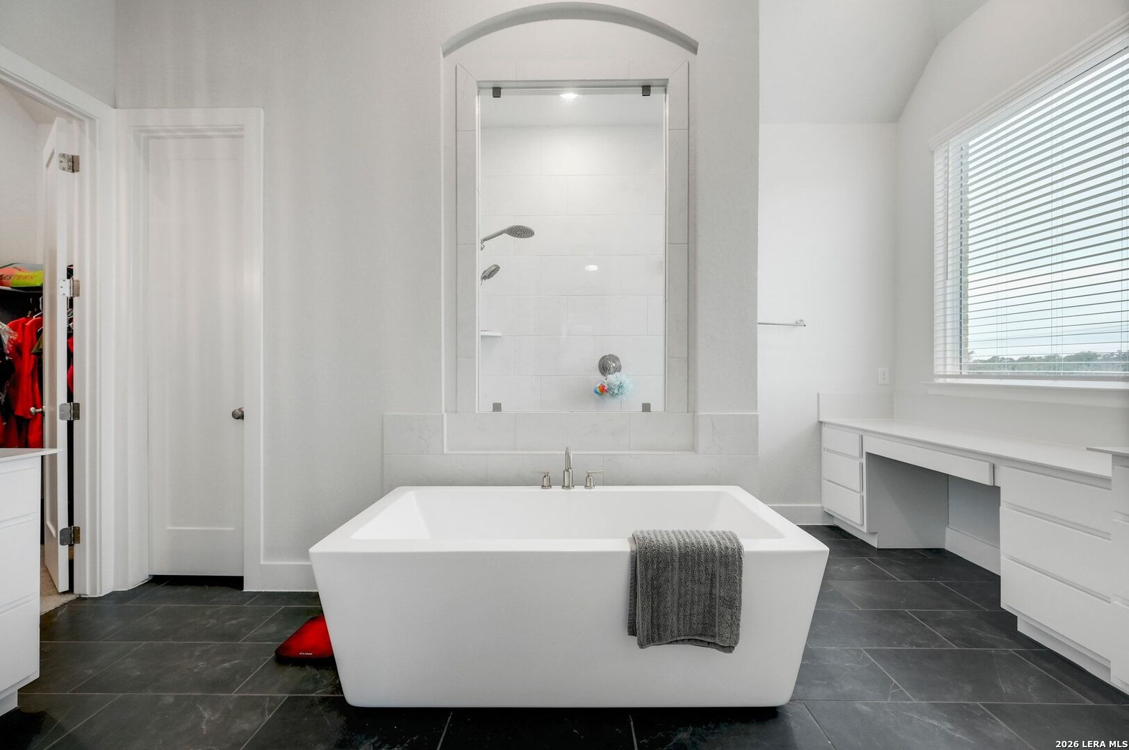 1410 Lytham Bulverde, TX 78163 - Photo 20 of 35 a bathroom with a sink and mirror