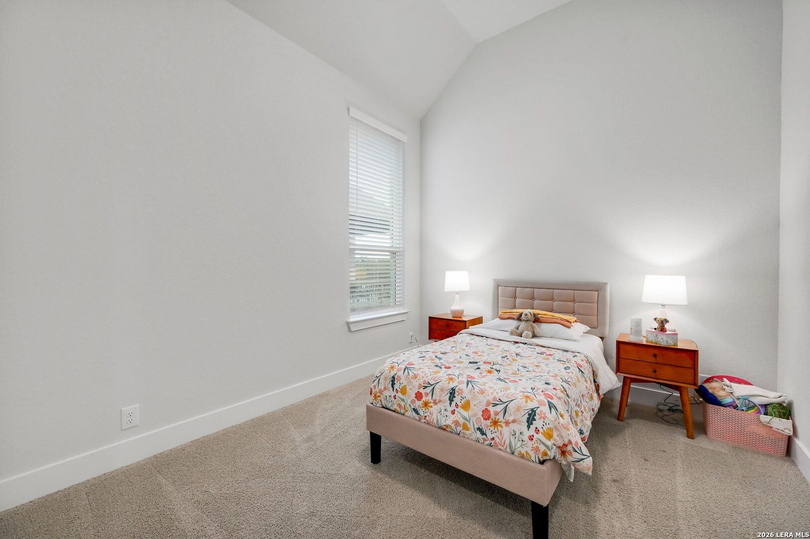 1410 Lytham Bulverde, TX 78163 - Photo 23 of 35 a bedroom with a bed and a window
