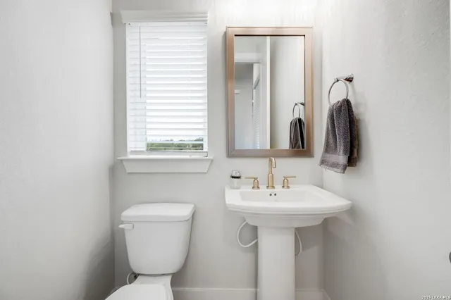 a balcony with table and chairs