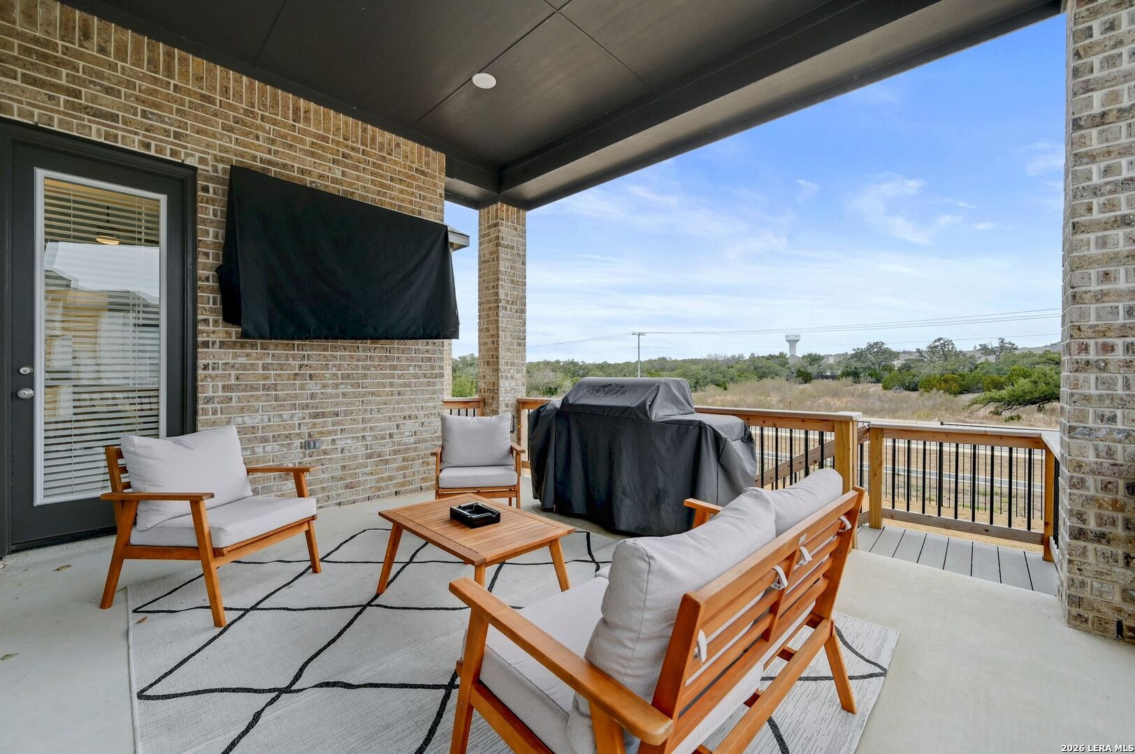 1410 Lytham Bulverde, TX 78163 - Photo 30 of 35 a view of a patio with a table and chairs
