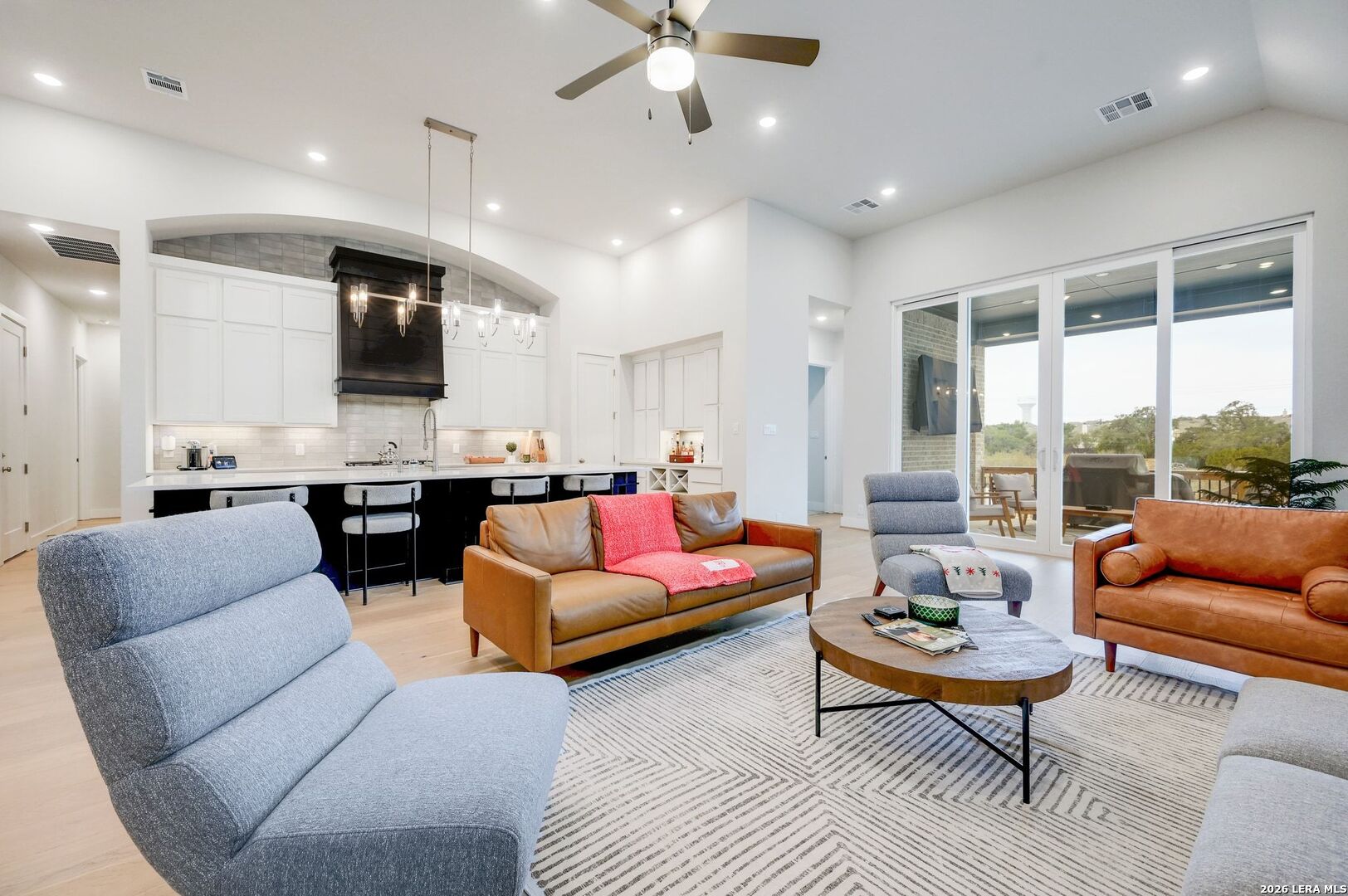1410 Lytham Bulverde, TX 78163 - Photo 8 of 35 a living room with furniture kitchen view and a large window