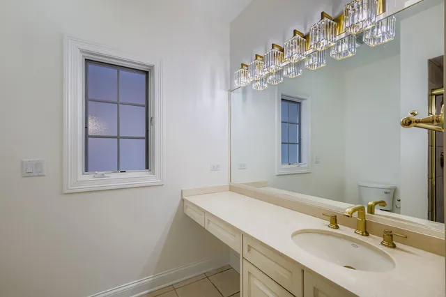 a bathroom with a sink vanity and a mirror